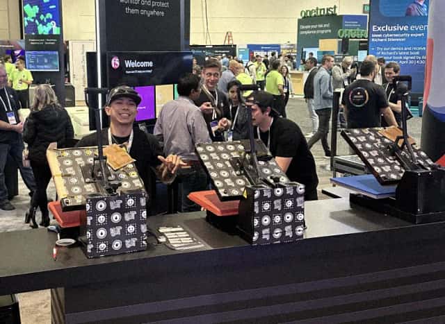 Our crew running heat presses inside a conference booth